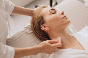 A woman receiving gua sha therapy